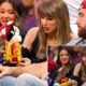 See funny moment Taylor Swift bursts into laughter after receiving a Cleveland Cavaliers mascot toy while Travis Kelce reacts differently courtside during the game